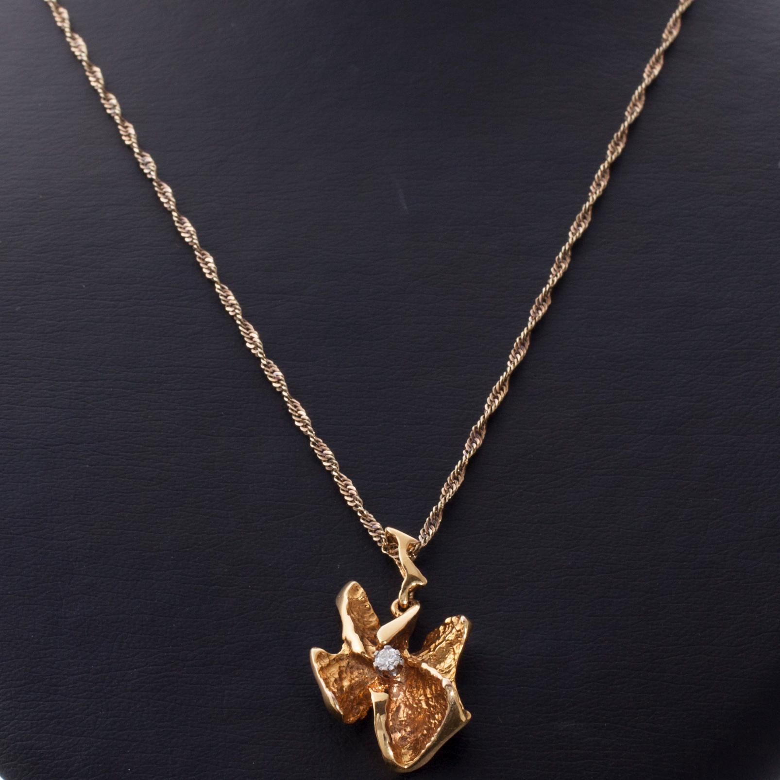 HÄNGE, 14K guld, briljantslipad diamant. Åbo, 1983. Vikt ca 9,1 g.
