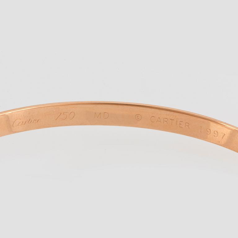 A Cartier "Trinity" bracelet.