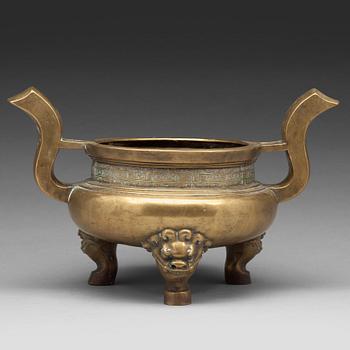 A large brass tripod censer, Qing dynasty (1644-1912).