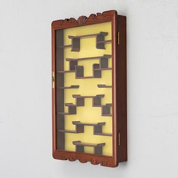 A wall-hanged display cabinet, China, second half of the 20th century.