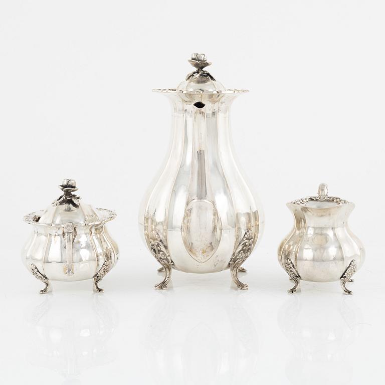 A silver coffee pot, a sugarbowl and a creamer, Swedish import marks, 20th Century.