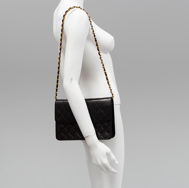 A black lambskin handbag by Chanel 1997-99.