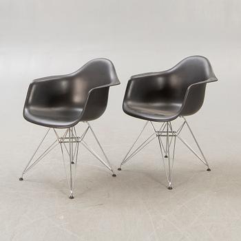 Charles and Ray Eames, armchairs a pair of "Eames plastic chair - DAR" for Vitra 2010.