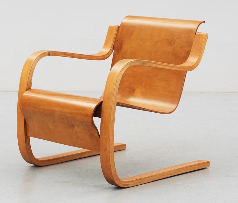 An Alvar Aalto birch armchair, 'Nr 31' by  O.y Huonekalu-ja Rakennustyötehdas A.B, Finland, probably 1940's.