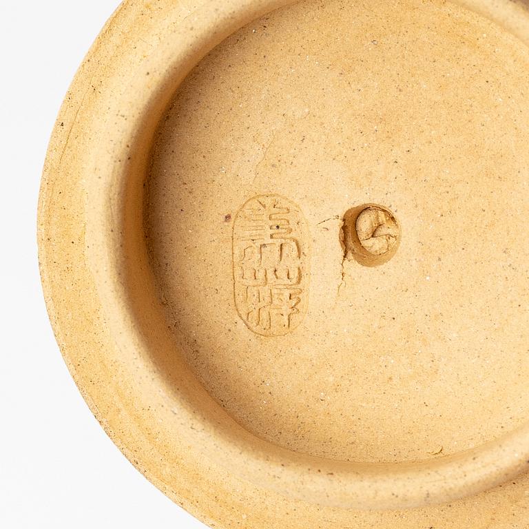 A group of three bright yellow yixing 'Gongfu' teapots, China, 1990s.