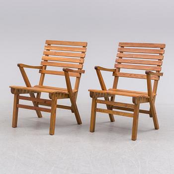 A pair of garnde armchairs by Carl Malmsten.