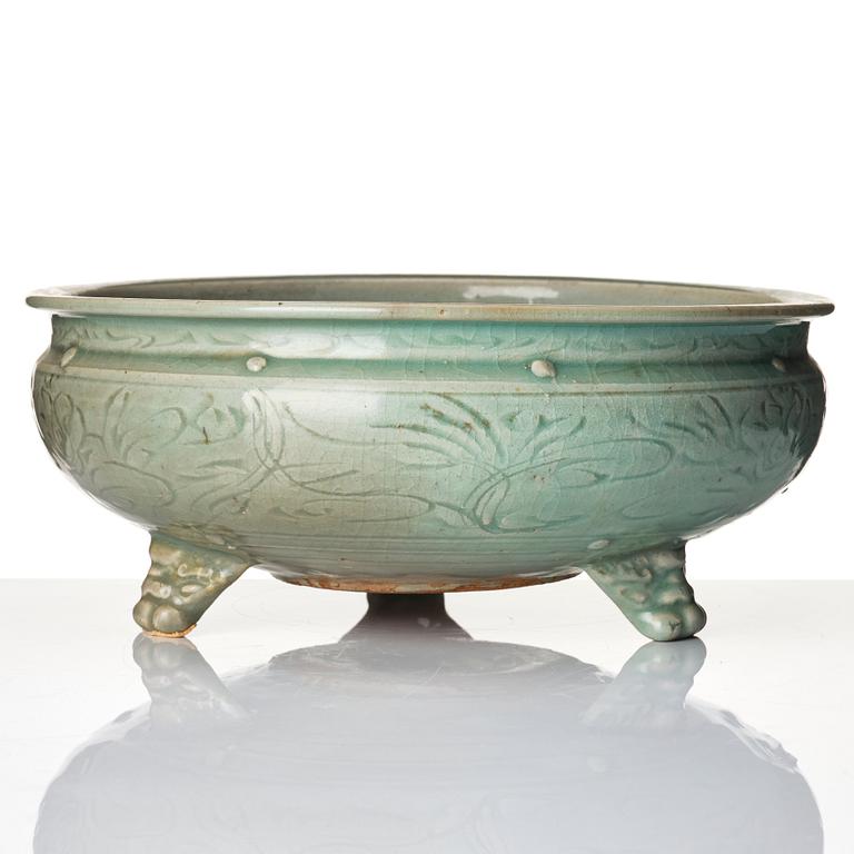 A celadon glazed tripod censer, Ming dynasty (1368-1644).