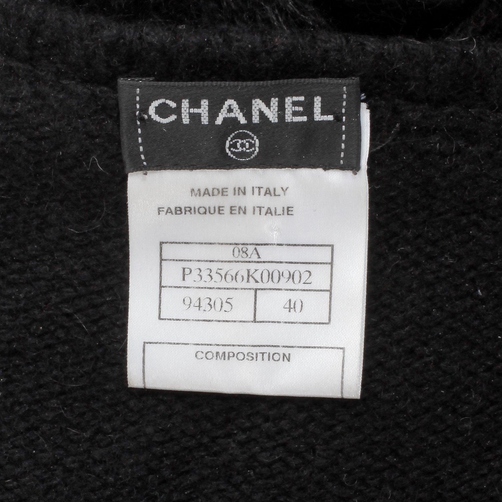 CHANEL, a black cashmere carding and a bouclé skirt.