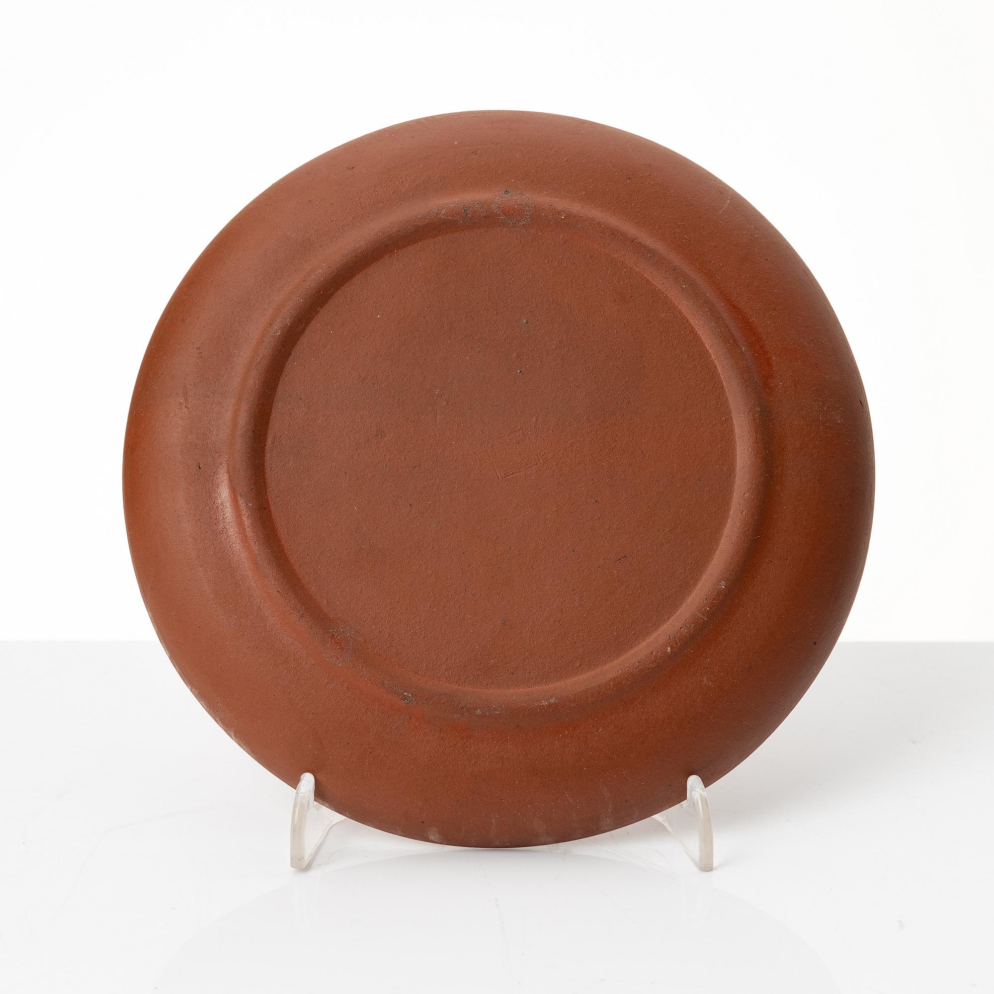 A six part red yixing Gongfu set; teapot, four cups and a tray, China, 1980s.