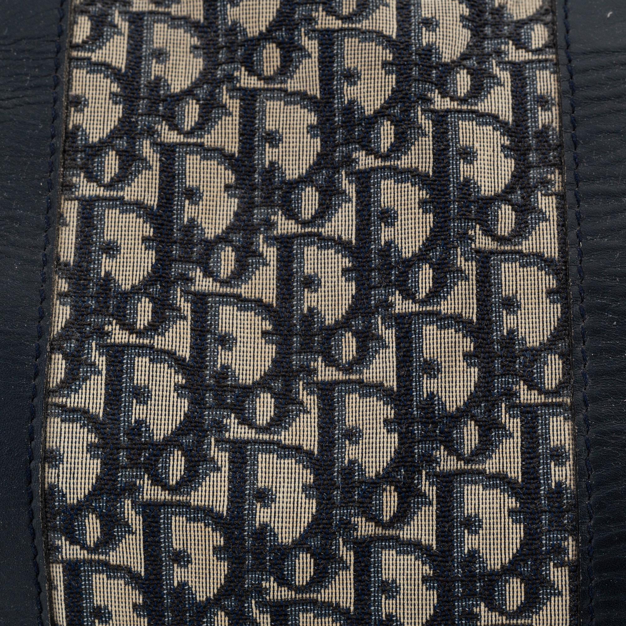 Christian Dior, a canvas 'Speedy' weekendbag and belt, size 85.