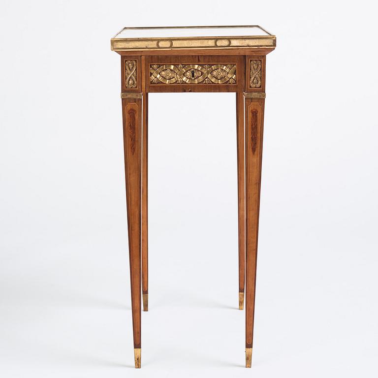 A Gustavian marquetry, ormolu-mounted, and marble table by G. Iwersson (master in Stockholm 1778-1813), signed 1781.