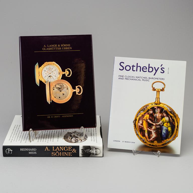 A set of 6 watch books.