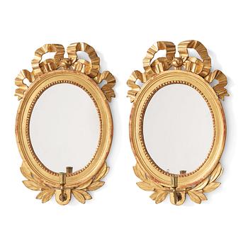 A pair of Gustavian late 18th century one-light girandole mirrors.