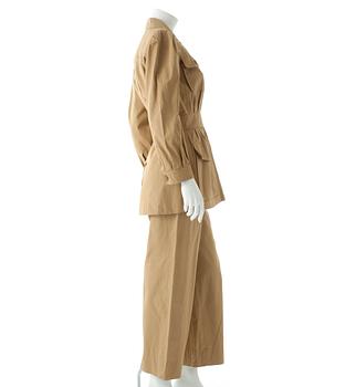 YVES SAINT LAURENT,a two-piece beige cotton dress consisting of jacket and pants, from the Safari collection s/s 1968.