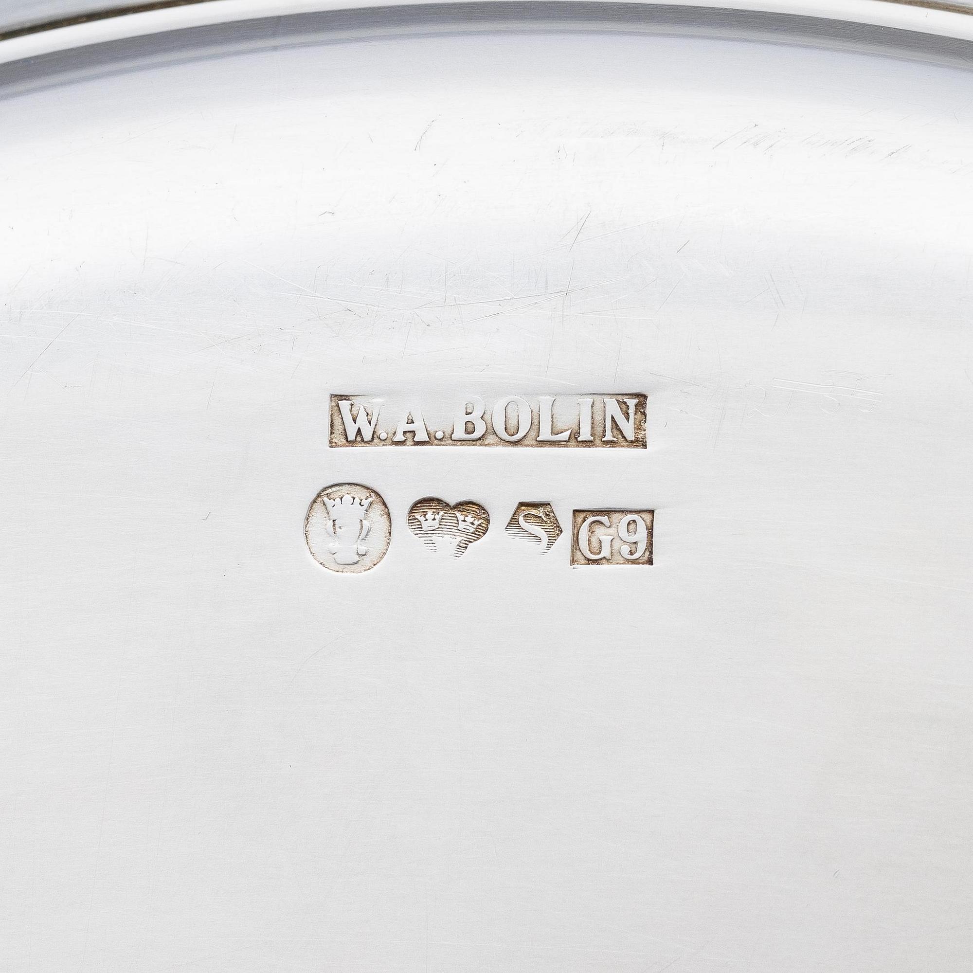 A Swedish silver dish and two silver coasters, marks of W.A. Bolin, Stockholm 1957.