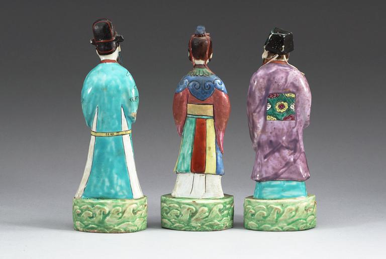 A set of three famille rose figures of immortals, Qing dynasty, ca 1800.