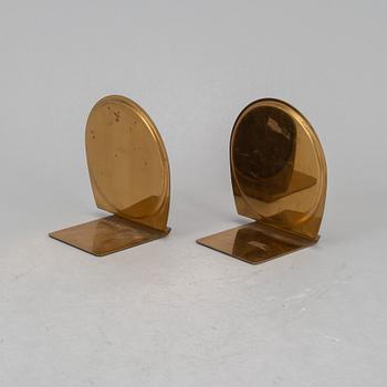 A pair of brass book ends, mid 20th century.