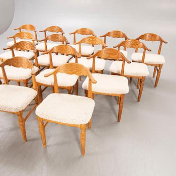 A set of 14 Henning Kjaerulf 1950s oak chairs.