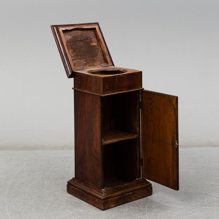 A Swedish Empire bedside table, early 19th century.