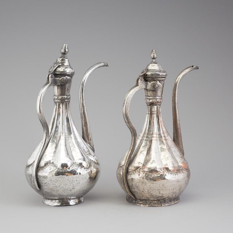 A pair of silver plated jugs, the 20th century.