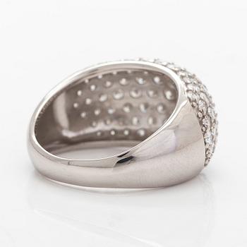 A platinum bombé ring with brilliant-cut diamonds.