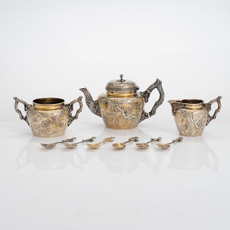 A 9-piece parcel-gilt sterling silver tea set, maker's mark of Samuel Smily, Goldsmiths Alliance Ltd, London 1873-74.