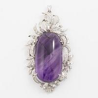 Pendant with a cabochon-cut amethyst and eight-cut diamonds.