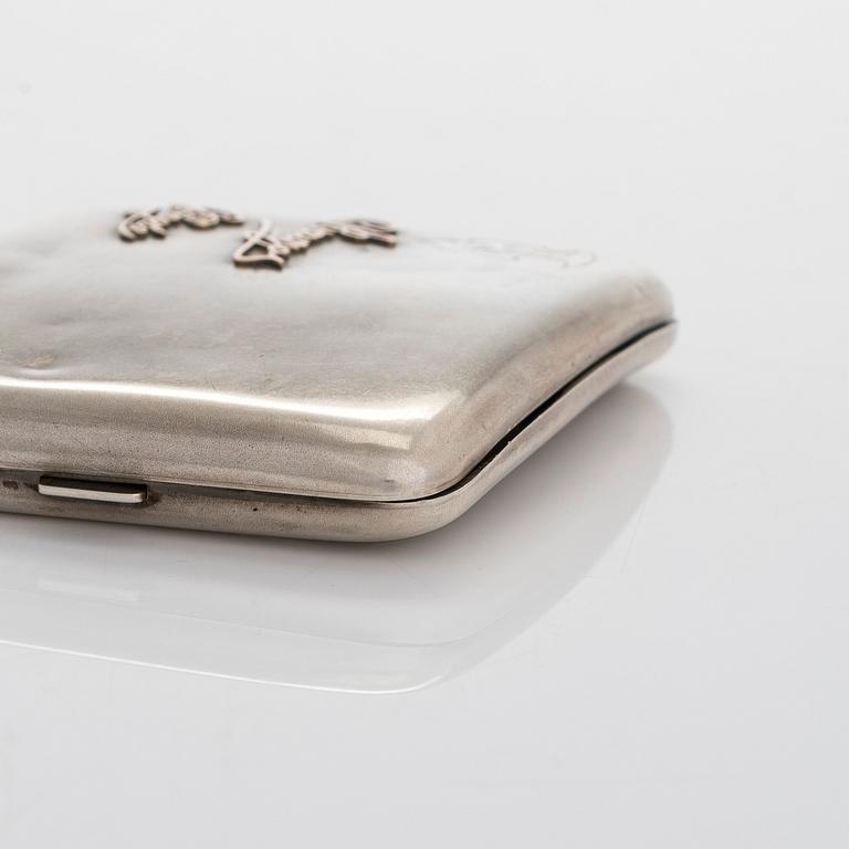 Two silver cigarette cases, J. H. Werner, Berlin, 1922, and Huguenin Frères, Switzerland before 1933.