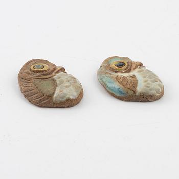 Tyra Lundgren, two stoneware pendants.