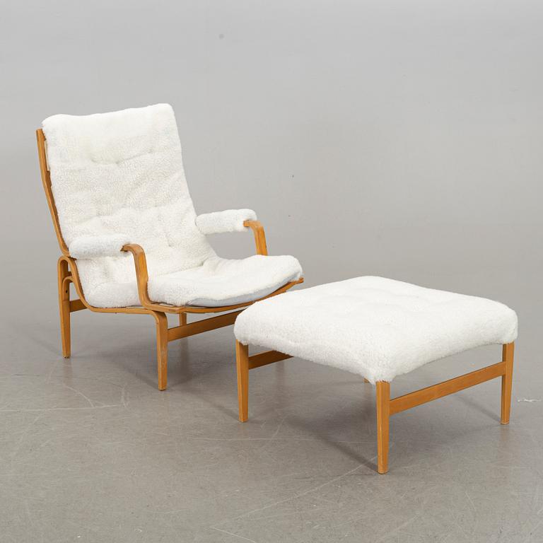 BRUNO MATHSSON, an "ingrid" armchair and stool for Dux. Late 20th century.