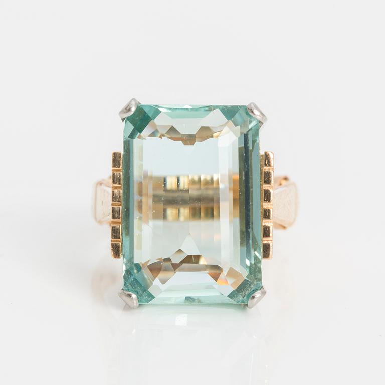 A step-cut aquamarine ring.