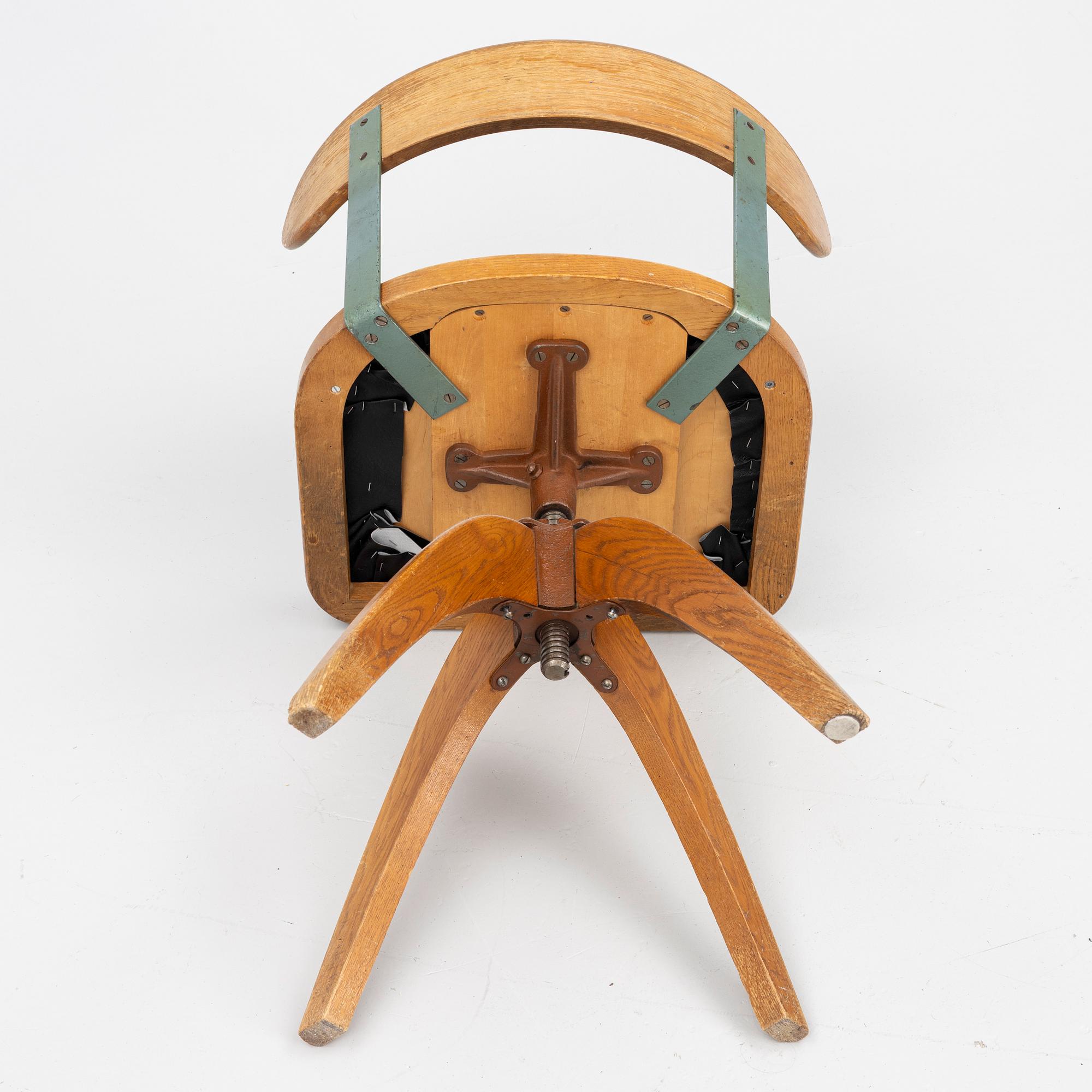A 1920's swivel desk chair.
