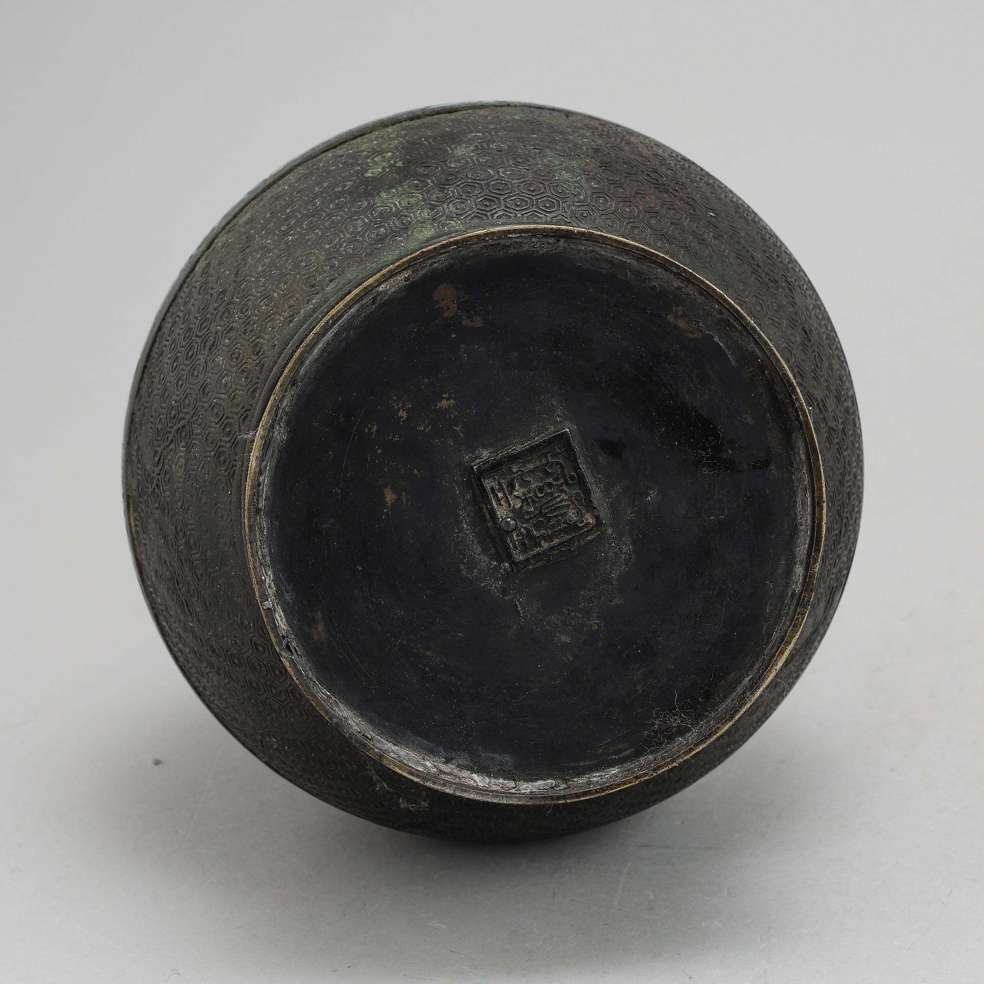 A Chinese bronze and cloisonné vase, around the year 1900.