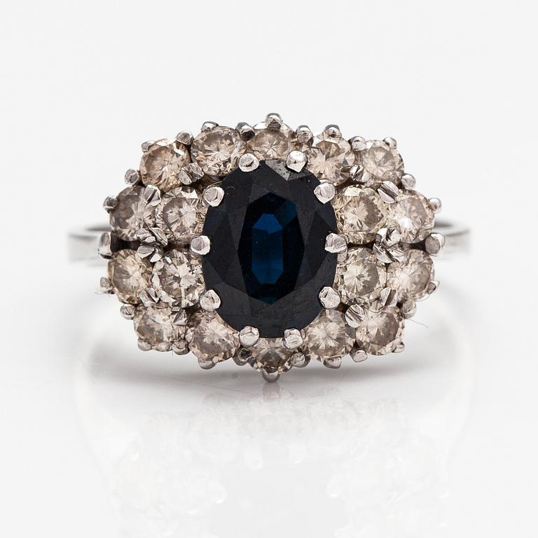 A 14K white gold ring with a sapphire ca. 1.24 ct and diamonds ca 1.25 ct in total. Finnsh import marks 1994.
