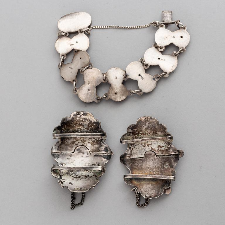 A Russian silver and niello bracelet and two belt buckles, unidentified makers mark, Kiev 1896-1908 and other.