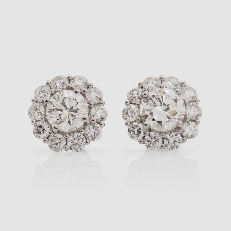 A pair of brilliant-cut earrings, total carat weight circa 3.90 cts.
