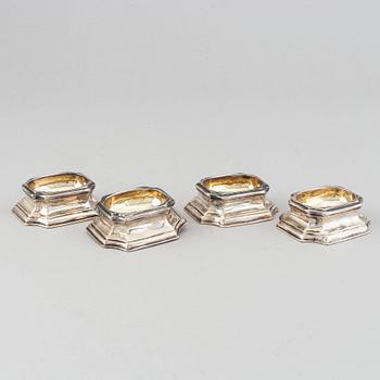 Four English early 18th century parcel-gilt silver salt-cellars, mark of Edward Wood, London 1727.