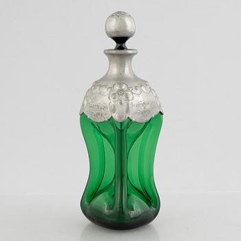 A green glass bottle with stopper, Sweden, early 20th century.