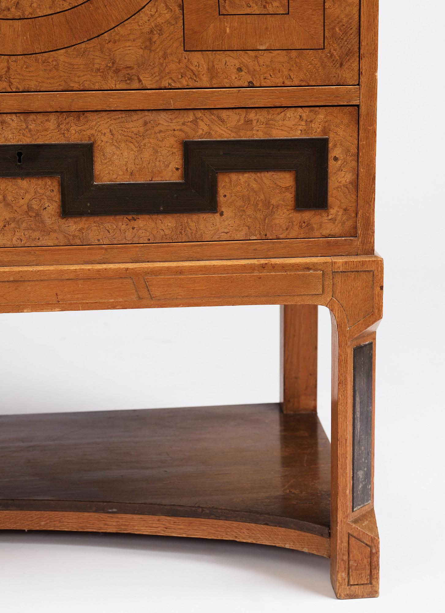 Carl Bergsten, an oak veneered sideboard/ chest of drawers, Nordiska Kompaniet Sweden 1923. Part of a set exhibited in Gothenburg 1923.