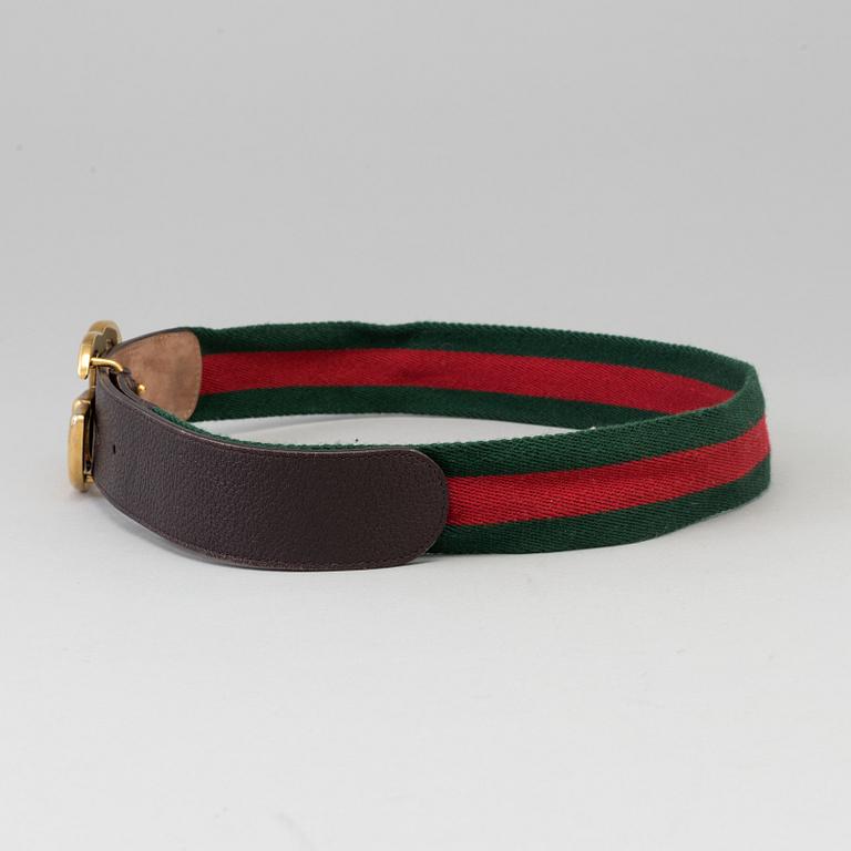 A canvas belt by Gucci.