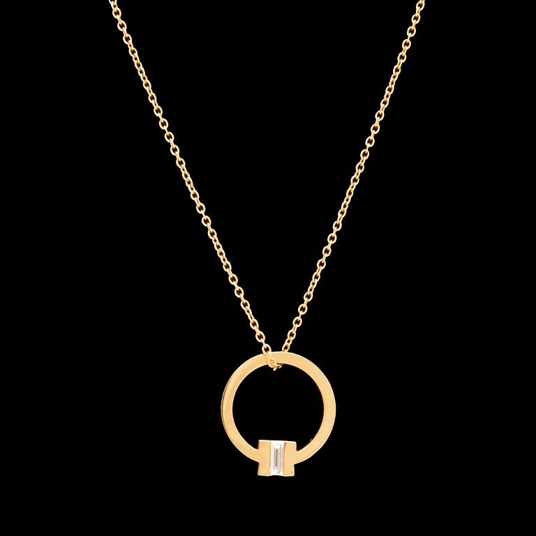 Tiffany & Co, "T" necklace in 18K gold with a baguette-cut diamond.