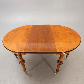 A Neo Renaissance dining table around 1900.