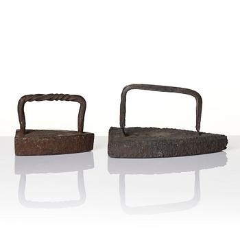 Two cast iron clothes irons, 18th / early 19th century.