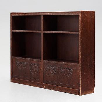 Otto Wretling, attributed to, an Art Nouveau carved pine book shelf, Umeå, Sweden, early 20th century.