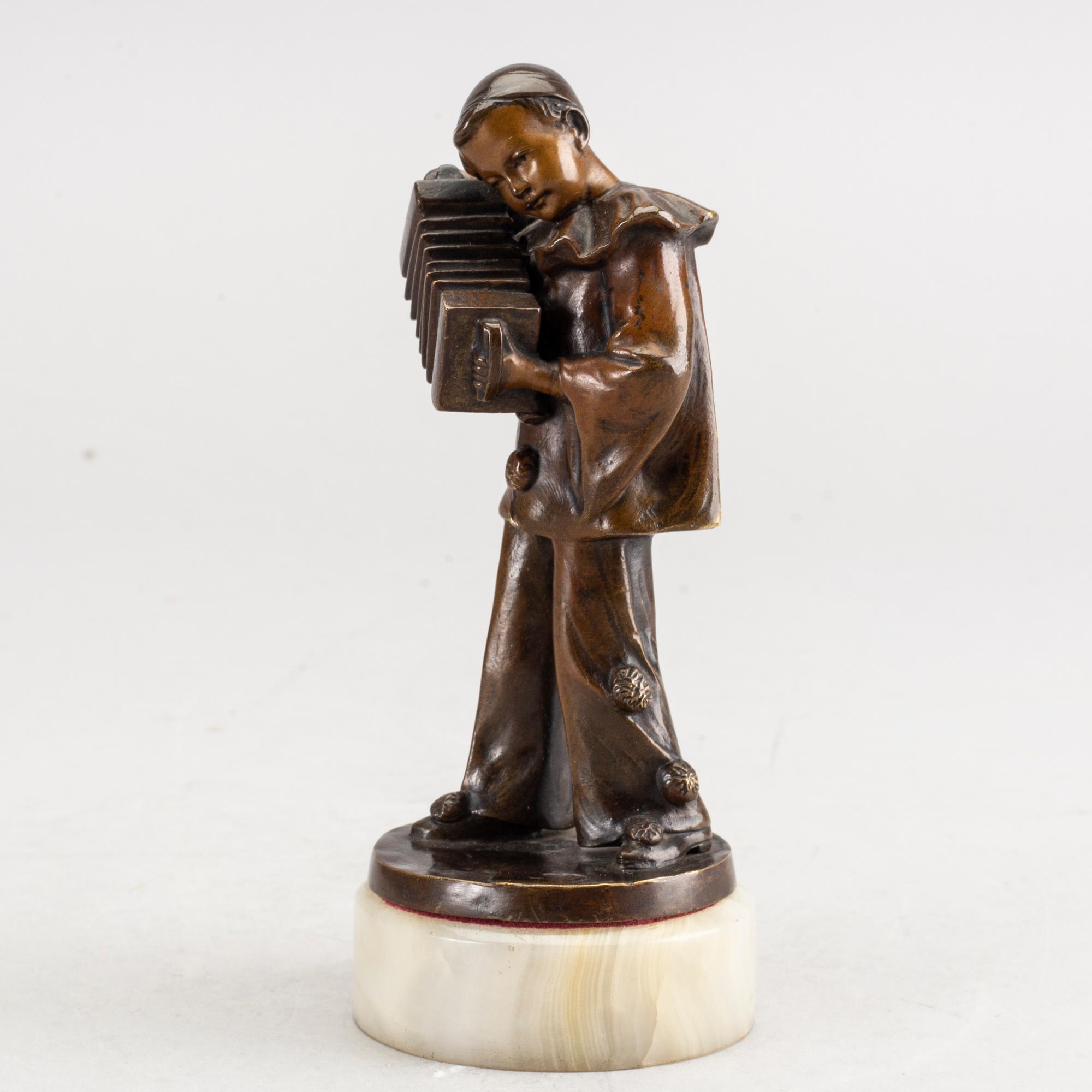 An early 20th century bronze with alabaster base by Francizek Jozef Kucharzyk.