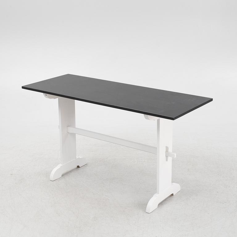 A painted table, 20th Century.