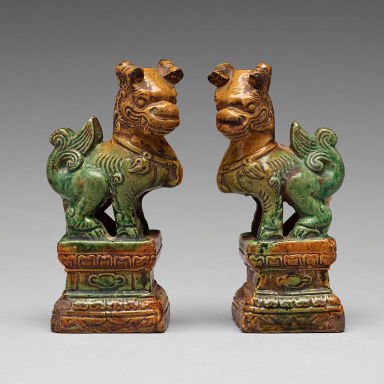 A pair of green and yellow glazed joss stick holders, Ming dynasty (1368-1644).