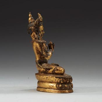 A gilt copper alloy figure of Manjushri, Nepal 15th/16th Century.