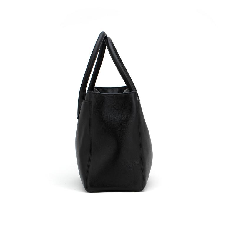 CHANEL,  a black leather bag.