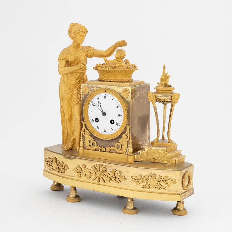 A French Empire gilt bronze mantle clock, early 20th Century.